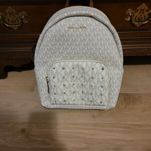 Michael Kors Cream Backpack with Gold Details, it is authentic never worn